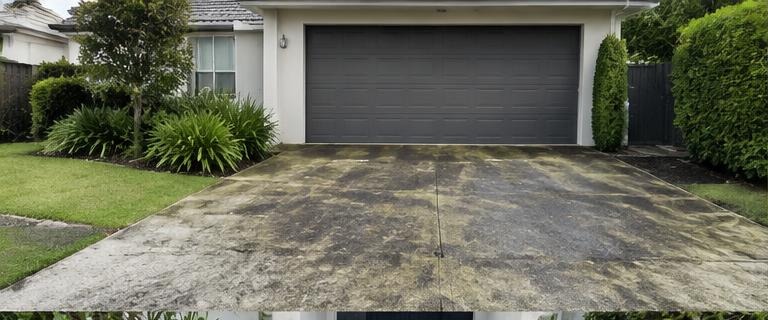 Illustrative driveway pressure washing before cleaning
