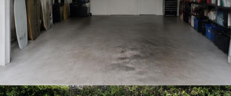 Illustrative garage floor cleaning before cleaning